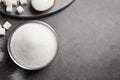 Flat lay composition with granulated sugar on table. Space for text