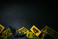 Flat lay composition with gun and crime scene marker on black slate background. Space for text Royalty Free Stock Photo