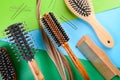 Flat lay composition with hairdresser\'s tools and strand of hair on color background Royalty Free Stock Photo