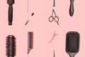 Flat lay composition with hairdresser set on pink background. Barber set with tools and equipment: scissors, combs and hairclips. Royalty Free Stock Photo