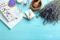 Flat lay composition with hand made  bars and lavender flowers on light blue wooden table, space for text Royalty Free Stock Photo