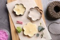 Flat lay composition of handmade candles with cutters Royalty Free Stock Photo