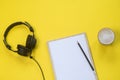 Flat lay composition with Headphones, microphone and coffee on a yellow background. Podcast or webinar concept Royalty Free Stock Photo
