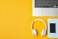 Flat lay composition with headphones, smartphone, laptop and space for text Royalty Free Stock Photo