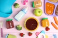 Flat lay composition with baby food, ingredients and accessories on pink wooden table Royalty Free Stock Photo