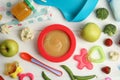 Flat lay composition with healthy baby food, ingredients and accessories on white table Royalty Free Stock Photo