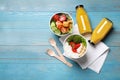 Flat lay composition with healthy takeaway food on light blue wooden table. Space for text Royalty Free Stock Photo