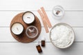 Flat lay composition with homemade candles and ingredients on white wooden background Royalty Free Stock Photo