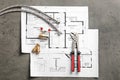 Flat lay composition with house plan and plumber`s items Royalty Free Stock Photo