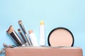 Flat lay composition with hygienic lipsticks on blue background Royalty Free Stock Photo