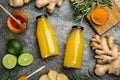 Flat lay composition with immunity boosting drink in bottles on grey table Royalty Free Stock Photo