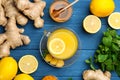 Flat lay composition with immunity boosting drink and ingredients on blue wooden table Royalty Free Stock Photo