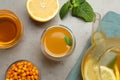 Flat lay composition with immunity boosting drink and ingredients on light grey table Royalty Free Stock Photo