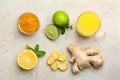 Flat lay composition with immunity boosting drink and ingredients on light table Royalty Free Stock Photo