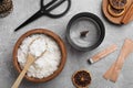 Flat lay composition with ingredients for homemade candles on grey background Royalty Free Stock Photo