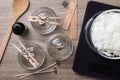 Flat lay composition with ingredients for homemade candles on wooden background Royalty Free Stock Photo