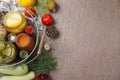 Flat lay composition with jars of pickled vegetables on brown table. Royalty Free Stock Photo