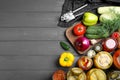 Flat lay composition with jars of pickled vegetables on grey wooden table Royalty Free Stock Photo