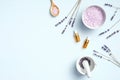 Flat lay composition with lavender essential oil, violet sea salt, mortar and pestle. Top view SPA natural organic cosmetic for