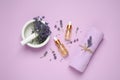 Flat lay composition with lavender flowers and natural essential oil on background Royalty Free Stock Photo