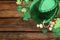 Flat lay composition with leprechaun hat on wooden table, space for text. St Patrick`s Day celebration Royalty Free Stock Photo