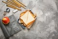 Flat lay composition with lunch box, tasty sandwich Royalty Free Stock Photo