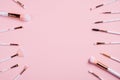 Flat lay composition with make up brushes on pink background. Makeup store banner mockup