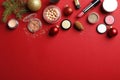 Flat lay composition with makeup products and Christmas decor on color background Royalty Free Stock Photo