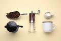 Flat lay composition with manual coffee grinder and beans on beige background Royalty Free Stock Photo