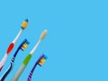 Flat lay composition with manual toothbrushes on blue background.Toothbrush and toothpaste.op view, flat lay. Minimal concept. Royalty Free Stock Photo