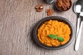 Flat lay composition with mashed sweet potatoes on brown background Royalty Free Stock Photo