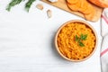 Flat lay composition with mashed sweet potatoes on wooden background Royalty Free Stock Photo