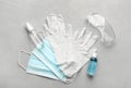 Flat lay composition with medical gloves, masks and hand sanitizers on grey background Royalty Free Stock Photo