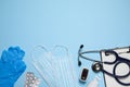 Flat lay composition with medical objects on light blue background, space for text Royalty Free Stock Photo