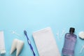 Flat lay composition with mouthwash and other oral hygiene products on light blue background. Space for text Royalty Free Stock Photo