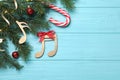 Flat lay composition with music notes on light blue wooden background, space for text. Christmas celebration Royalty Free Stock Photo