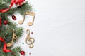 Flat lay composition with music notes on white wooden background, space for text. Christmas celebration Royalty Free Stock Photo