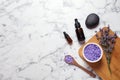 Flat lay composition with natural cosmetic products and lavender flowers on background. Space for text