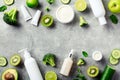 Flat lay composition with natural cosmetics and green mint, avocado, broccoli, kiwi, cucumber, lime, apple. Organic beauty Royalty Free Stock Photo