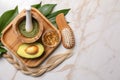 Flat lay composition with natural ingredients for hair care on marble background