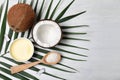 Flat lay composition with natural organic coconut oil on wooden background Royalty Free Stock Photo