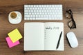 Flat lay composition of notebook with weekly plan on wooden table