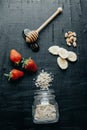 Flat lay composition Oatmeal, strawberry, honey, bananas on a bl