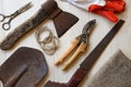 Flat lay composition with old secateurs and other gardening tools on white wooden table