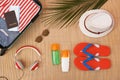 Flat lay composition with open suitcase and beach items Royalty Free Stock Photo