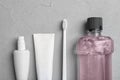 Flat lay composition with oral care products on light background. Royalty Free Stock Photo