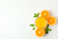 Flat lay composition with orange juice, oranges and mint on white background, space for text Royalty Free Stock Photo