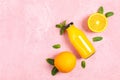 Flat lay composition with oranges, tubules, orange juice in bottle and mint on color background, space for text Royalty Free Stock Photo