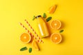 Flat lay composition with oranges, tubules and orange juice in bottle, space for text Royalty Free Stock Photo