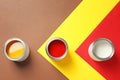 Flat lay composition with paint cans on color background Royalty Free Stock Photo